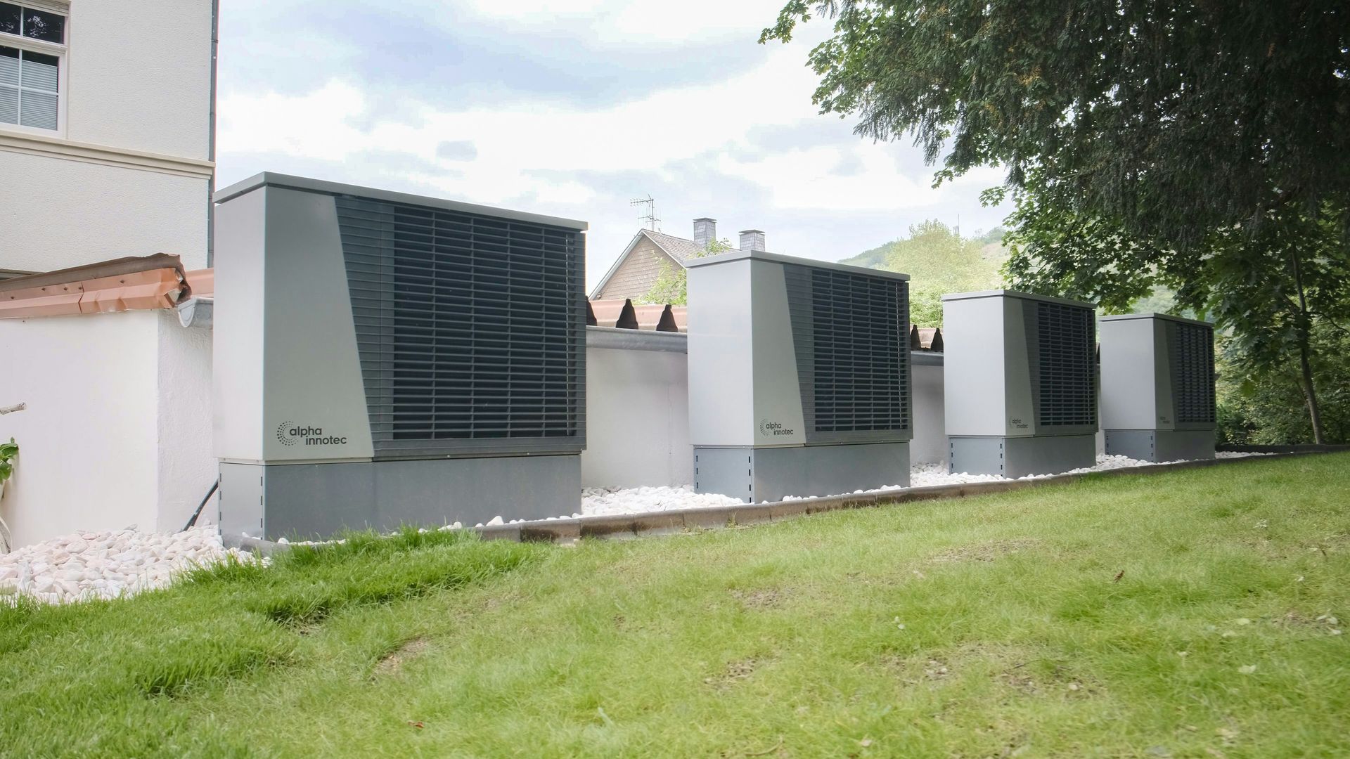 Large industrial air conditioning units lined up outside building